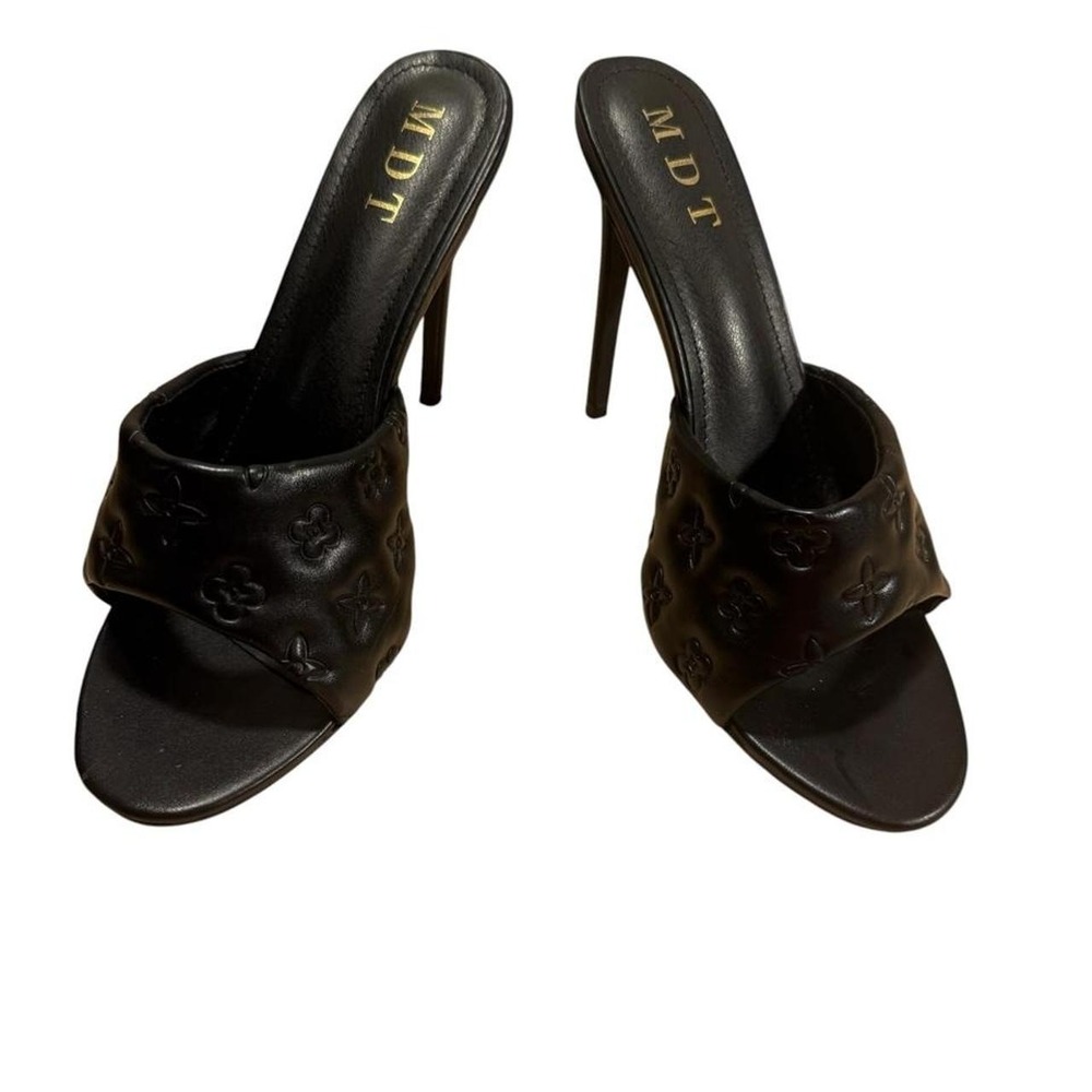 MDT black  mules with repeating monogram pattern